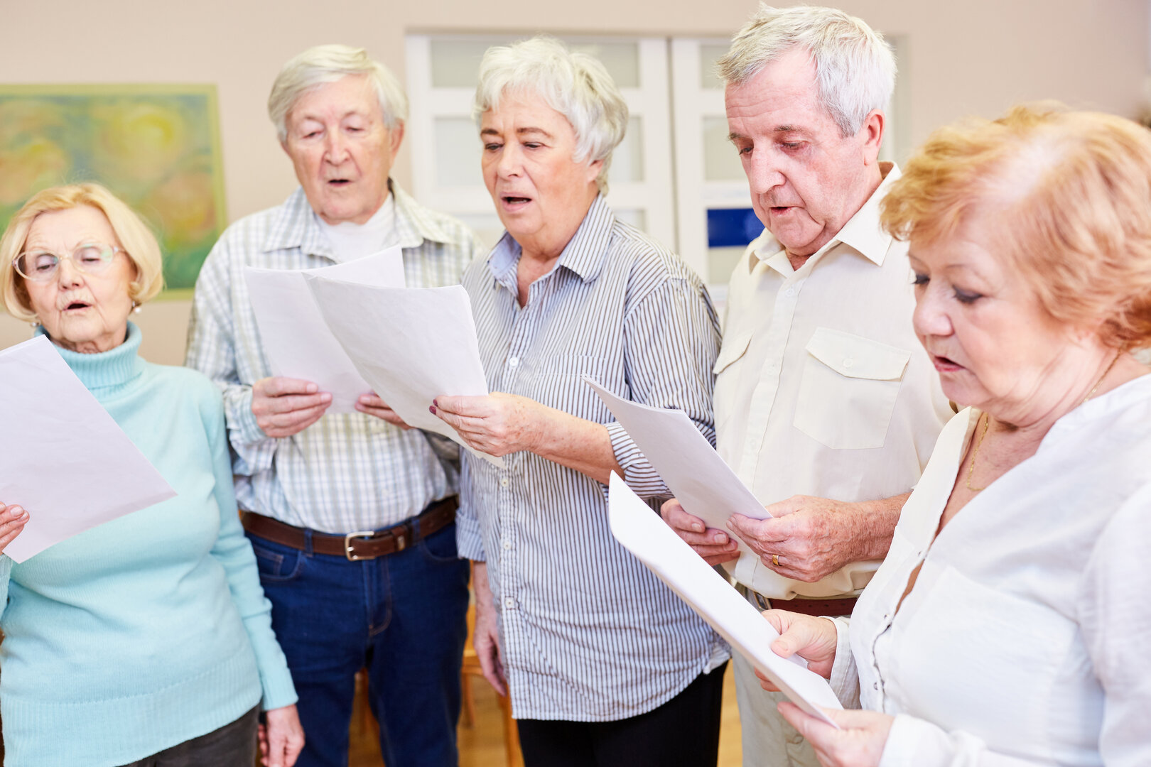 Seniors group sings together in a choir in their free time or as a dementia therapy